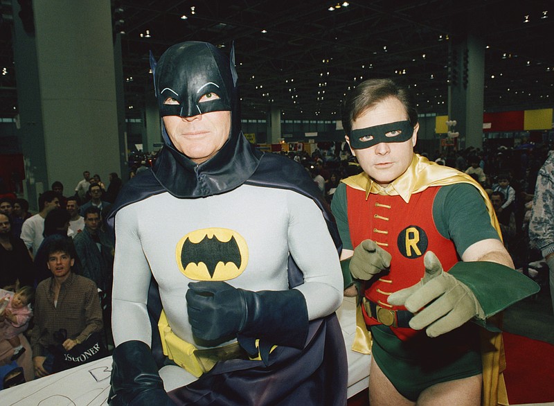 
              FILE - In this Jan. 27, 1989, file photo, actors Adam West, left, and Burt Ward, dressed as their characters Batman and Robin, pose for a photo at the "World of Wheels" custom car show in Chicago. Los Angeles Mayor Eric Garcetti says the Bat-Signal will shine over the city on Thursday, June 15, 2017 in tribute to West, who died June 9 at the age of 88. (AP Photo/Mark Elias, File)
            