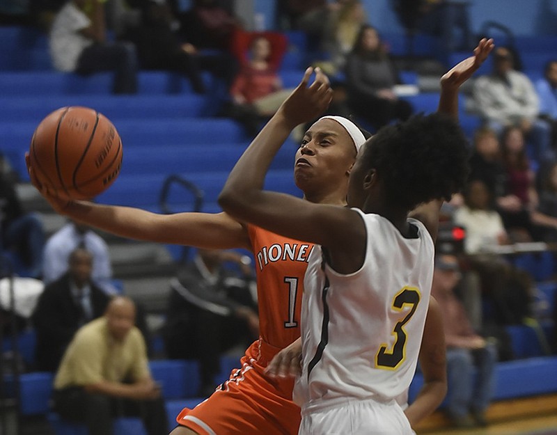 East Ridge's Jayla Stone drives past Hixson's Jada Johnson during a game in February 2016. Stone will continue her basketball career at GNTC, the college announced this week.