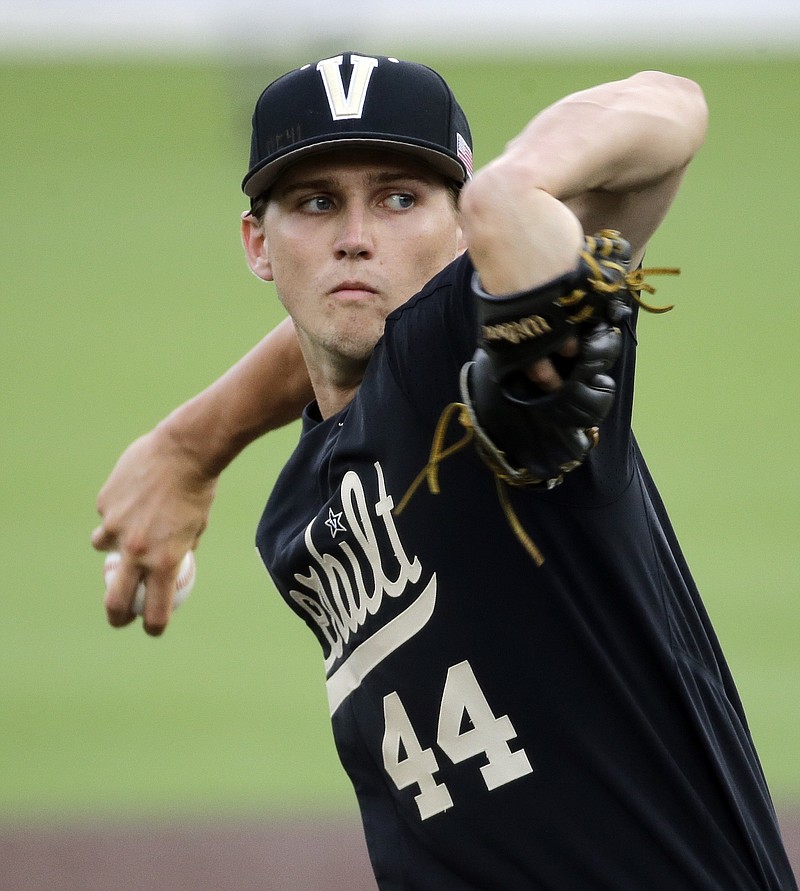 
              FILE - In this June 4, 2016, file photo, Vanderbilt starter Kyle Wright pitches against Washington in the first inning of an NCAA college baseball regional tournament game, in Nashville, Tenn. Pitcher Kyle Wright and the Atlanta Braves agreed to a minor league contract with a $7 million signing bonus, the highest in baseball since 2011, Friday, June 16, 2017. (AP Photo/Mark Humphrey, File)
            