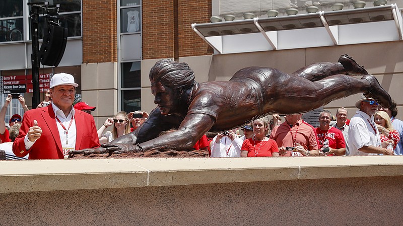 
              Former Cincinnati Reds player Pete Rose smiles as he stands for pictures during the dedication of his statue outside Great American Ballpark prior to a baseball game between the Cincinnati Reds and the Los Angeles Dodgers, Saturday, June 17, 2017, in Cincinnati. (AP Photo/John Minchillo)
            