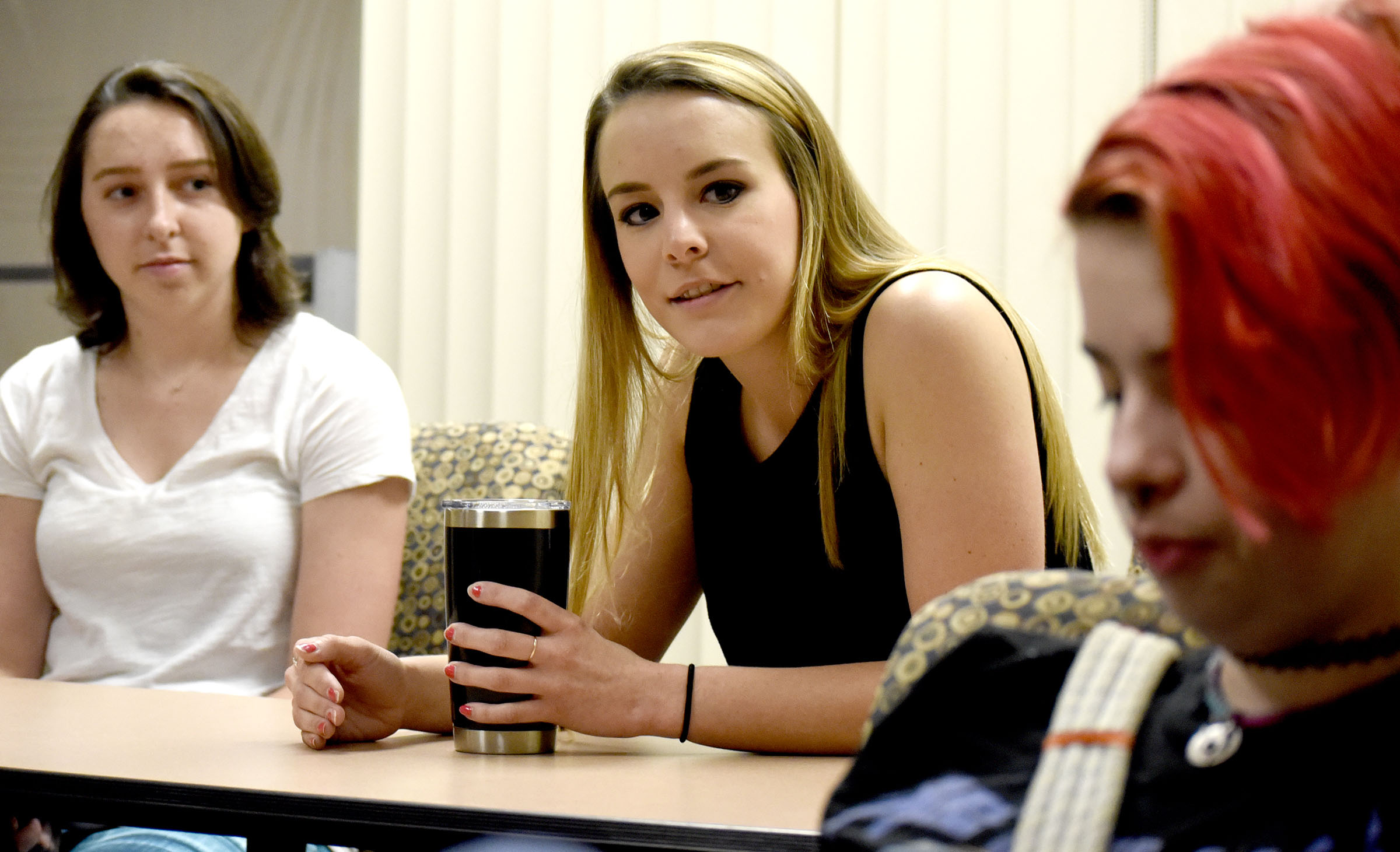 Lindsey Chesmar, center, talks about her experience with the Global Scholars program while Cameron