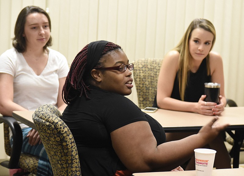 D'Onna Hammond talks about her experiences with the Global Scholars program, while fellow scholars, Cameron "Scout" Azar, left, and Lindsey Chesmar, right, looks on.  The Chattanooga Times Free Press interviewed some of Chattanooga State Community College's Global Scholars about their recent trip to Greece to work with Syrian refugees on June 13, 2017.  