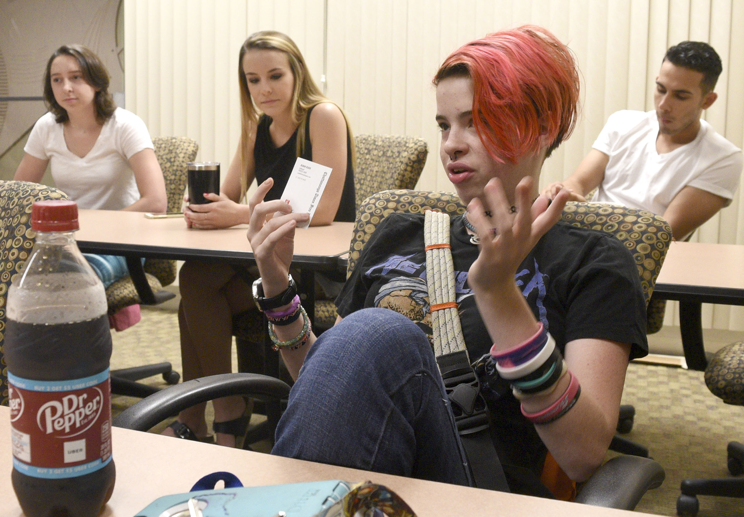 Holly Hess, foreground, talks about her experiences with the Global Scholars program, while fellow scholars, from left, Cameron