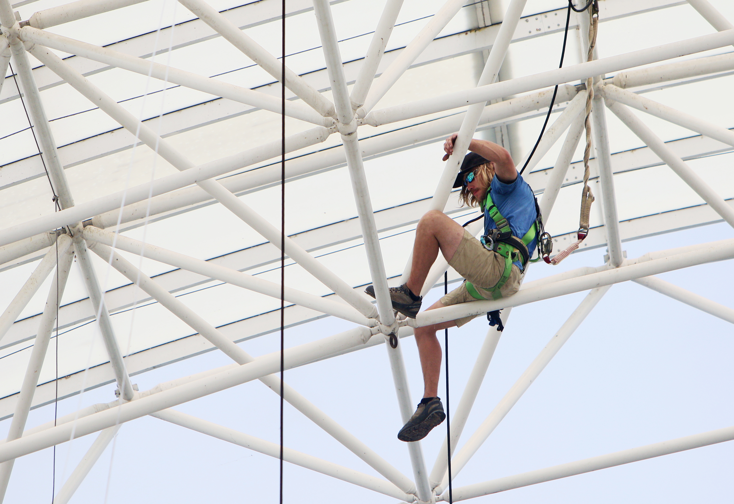 Sunny Trewhitt, a rigger with the International Alliance of Theatrical Stage Employees local 140, works on getting cables from the top of the Coke Stage at Ross's Landing in Chattanooga, Tenn., Sunday, June 18, 2017. It took about four days for the Coke Stage to be put together, and workers expect it to take a couple of days to dismantle everything.