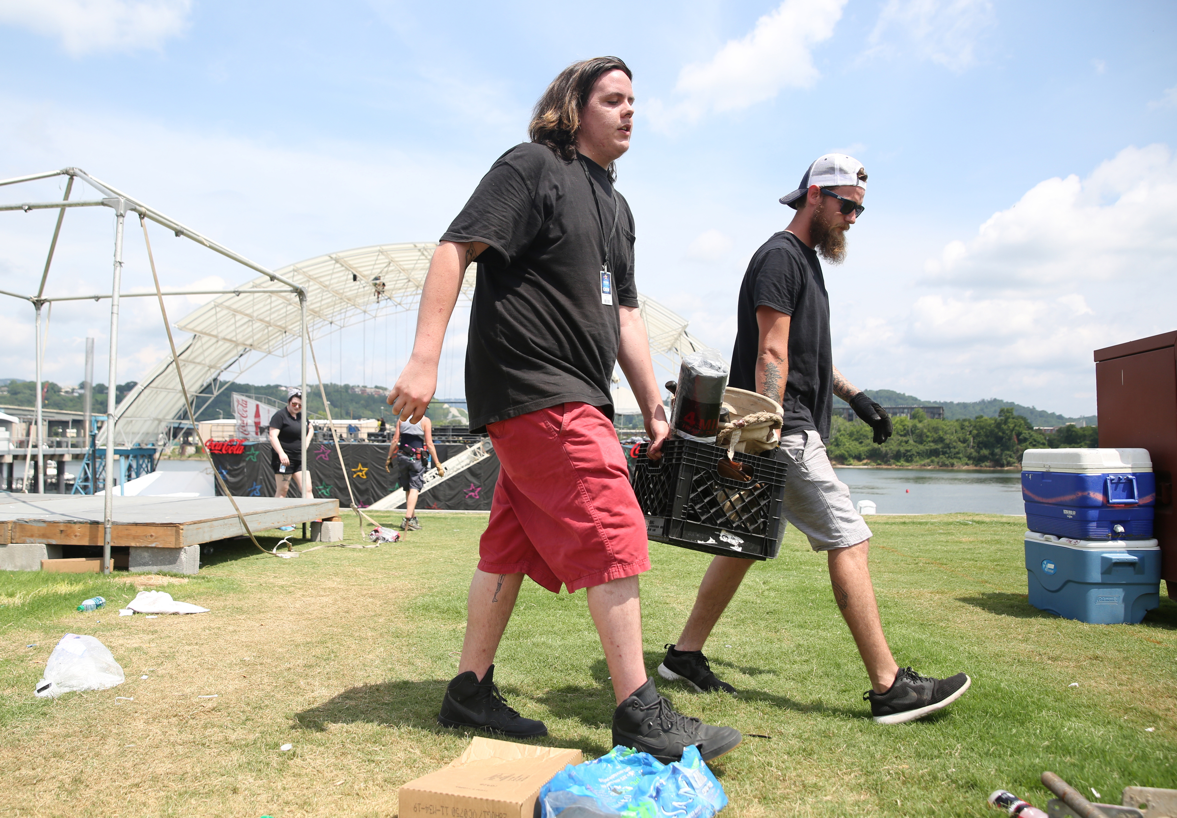 Hunter Croft and Dylan Rigler with the International Alliance of Theatrical Stage Employees load up lighting gear after the completion of Riverbend Festival at Ross's Landing in Chattanooga, Tenn., Sunday, June 18, 2017. After more than a week of performances, Riverbend Festival 2017 is over.