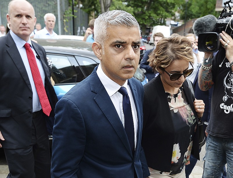 
              Mayor of London Sadiq Khan and his wife Saadiya Khan arrive for a service at St Clements Church, near to Grenfell Tower in west London, Sunday, June 18, 2017. The British government Sunday scrambled to contain political fallout from the London high-rise inferno that has claimed at least 50 lives. The cause of Wednesday's blaze is still under investigation, but anger has mounted in the community amid reports that exterior paneling used in an extensive renovation completed last year may have spread the flames. (John Stillwell/PA via AP)
            