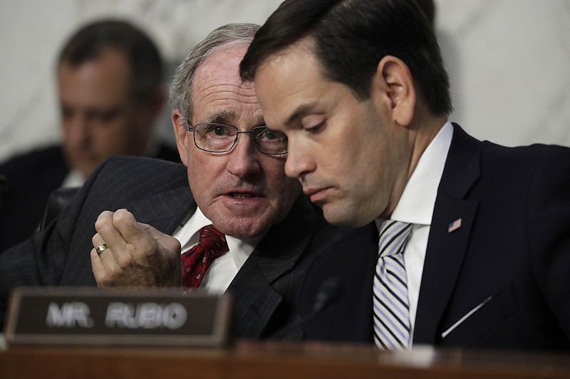 
              Senate Intelligence Committee members Sen. Jim Risch, R-Idaho, left, and Sen. Marco Rubio, R-Fla. confer on Capitol Hill in Washington, Tuesday, June 13, 2017, as Attorney General Jeff Sessions testified about his role in the firing of FBI Director James Comey and the investigation into contacts between Trump campaign associates and Russia. (AP Photo/J. Scott Applewhite)
            