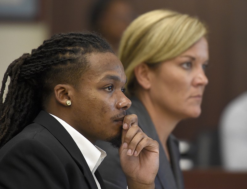 
              Brandon E. Banks and his attorney Katie Hagan listen during the Vanderbilt rape case trial at Justice A. A. Birch Building Monday, June 19, 2017, in Nashville, Tenn. Banks is charged with five counts of aggravated rape and two counts of aggravated sexual battery.  (Lacy Atkins/The Tennessean via AP, Pool)
            