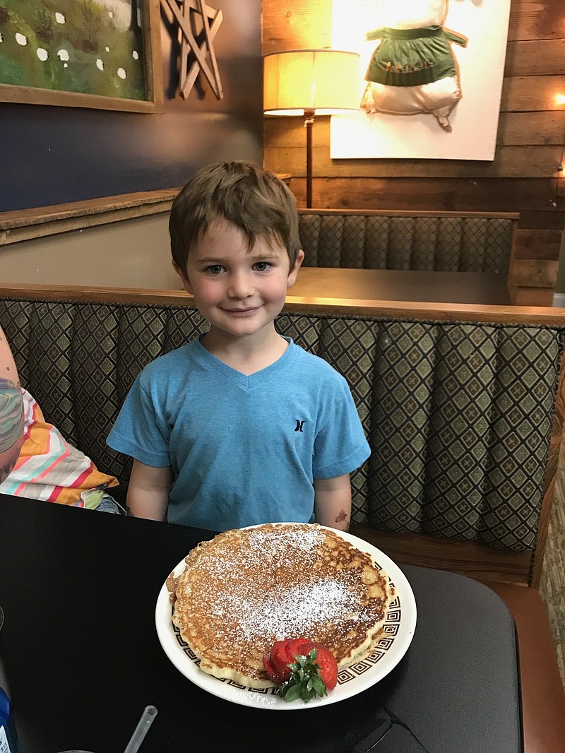 Max Filter sits down for breakfast at his namesake restaurant, which his grandparents Greg and Charla Filter recently opened in their hometown of Signal Mountain. (Contributed photo)