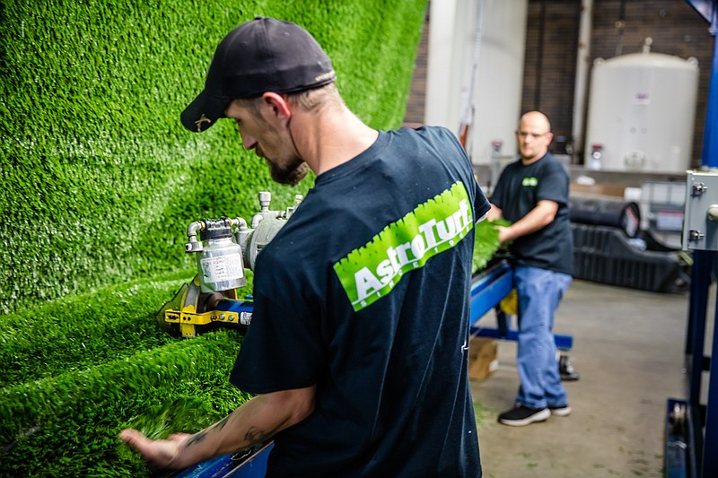 Contributed photo / AstroTurf employees work at the company's Dalton, Ga., facility. The business is consolidating manufacturing in one site.