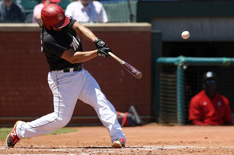 Chattanooga Lookouts third baseman T.J. White (33) hits a home run over the left field wall against the Jackson Generals in the bottom of the fourth inning at AT&T Field on Wednesday, June 7, in Chattanooga, Tenn.