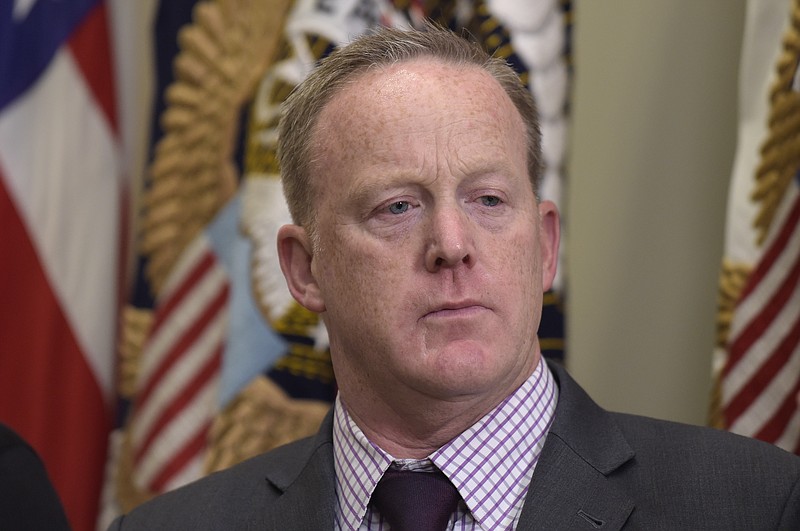 
              FILE - In this June 15, 2017, file photo, White House press secretary Sean Spicer waits for the start of an event in the Roosevelt Room of the White House in Washington. Spicer is seeking to take on a more strategic role within the White House that would give him a limited presence in the daily press briefings that have made him a prominent face of the Trump administration. A senior administration official and three people familiar with the potential changes said Spicer has discussed taking a more senior communications role at the White House.  (AP Photo/Susan Walsh, File)
            