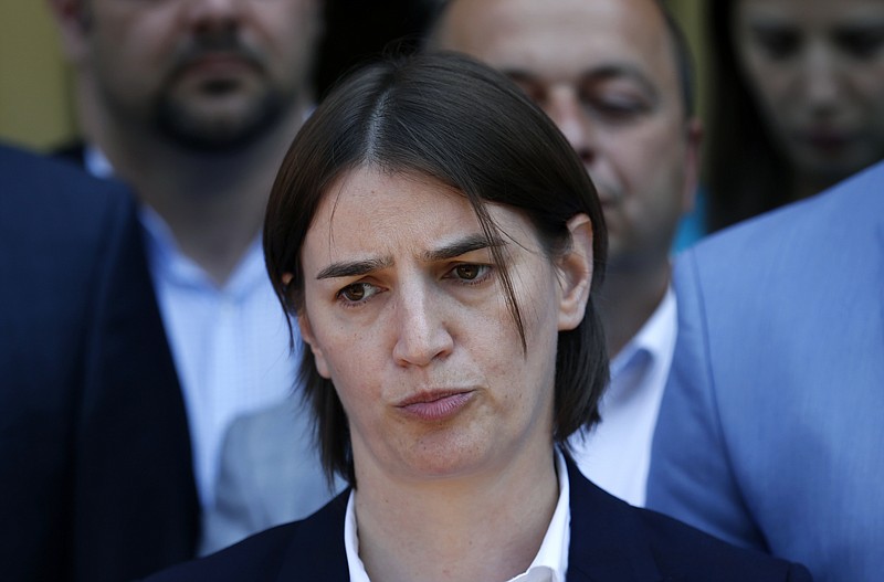 
              In this photo taken Friday, June 16, 2017, Serbia's Prime Minister-designate Ana Brnabic speaks to media in Vrnjacka Banja, Serbia. The ruling conservatives say that if Serbia's Prime Minister-designate Ana Brnabic does not get enough votes to be confirmed by parliament as the first openly gay person to head the country's government, early general elections would be held. (AP Photo/Darko Vojinovic)
            