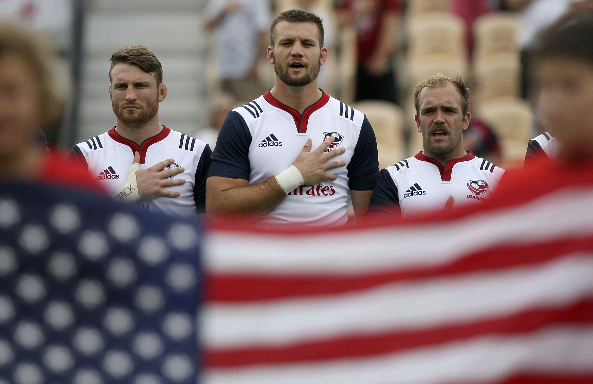 USA's Tony Lamborn, left, Cam Dolan and Shaun Davies stand during the playing of the national anthem before facing off against Georgia in an international rugby test match at Kennesaw State University's Fifth Third Bank Stadium on Saturday, June 17, in Kennesaw, Ga.