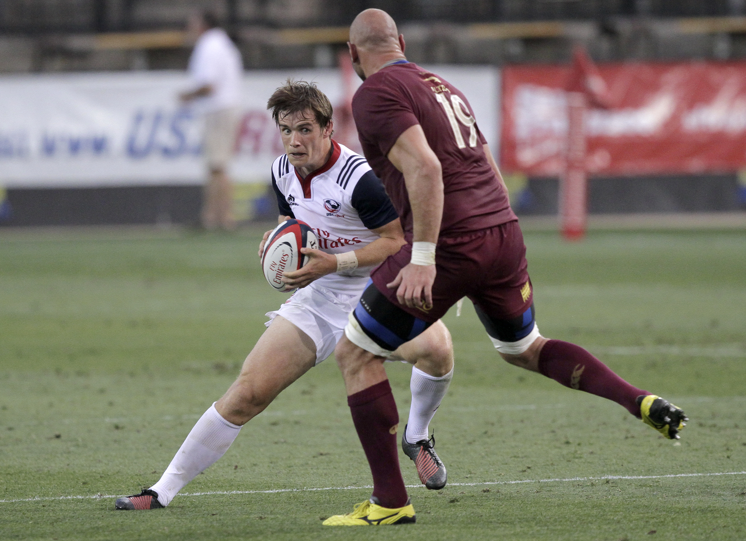 USA's AJ MacGinty sidesteps Georgia's Giorgi Chkhaidze (19) during an international rugby test match at Kennesaw State University's Fifth Third Bank Stadium on Saturday, June 17, in Kennesaw, Ga.