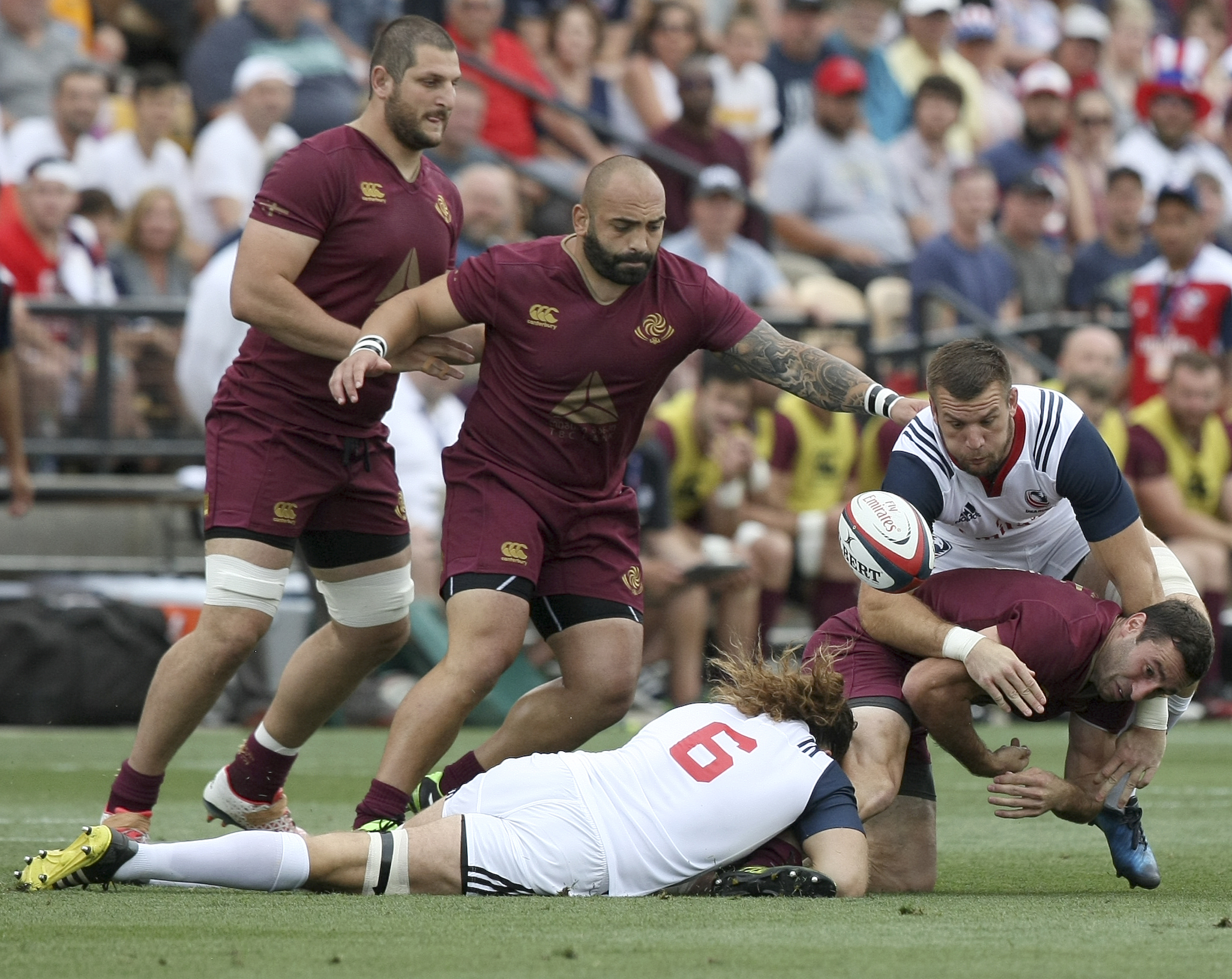 Georgia's Sandro Todua loses the ball as he's tackled by USA captain Todd Clever (6) and Cam Dolan during an international rugby test match at Kennesaw State University's Fifth Third Bank Stadium on Saturday, June 17, in Kennesaw, Ga.