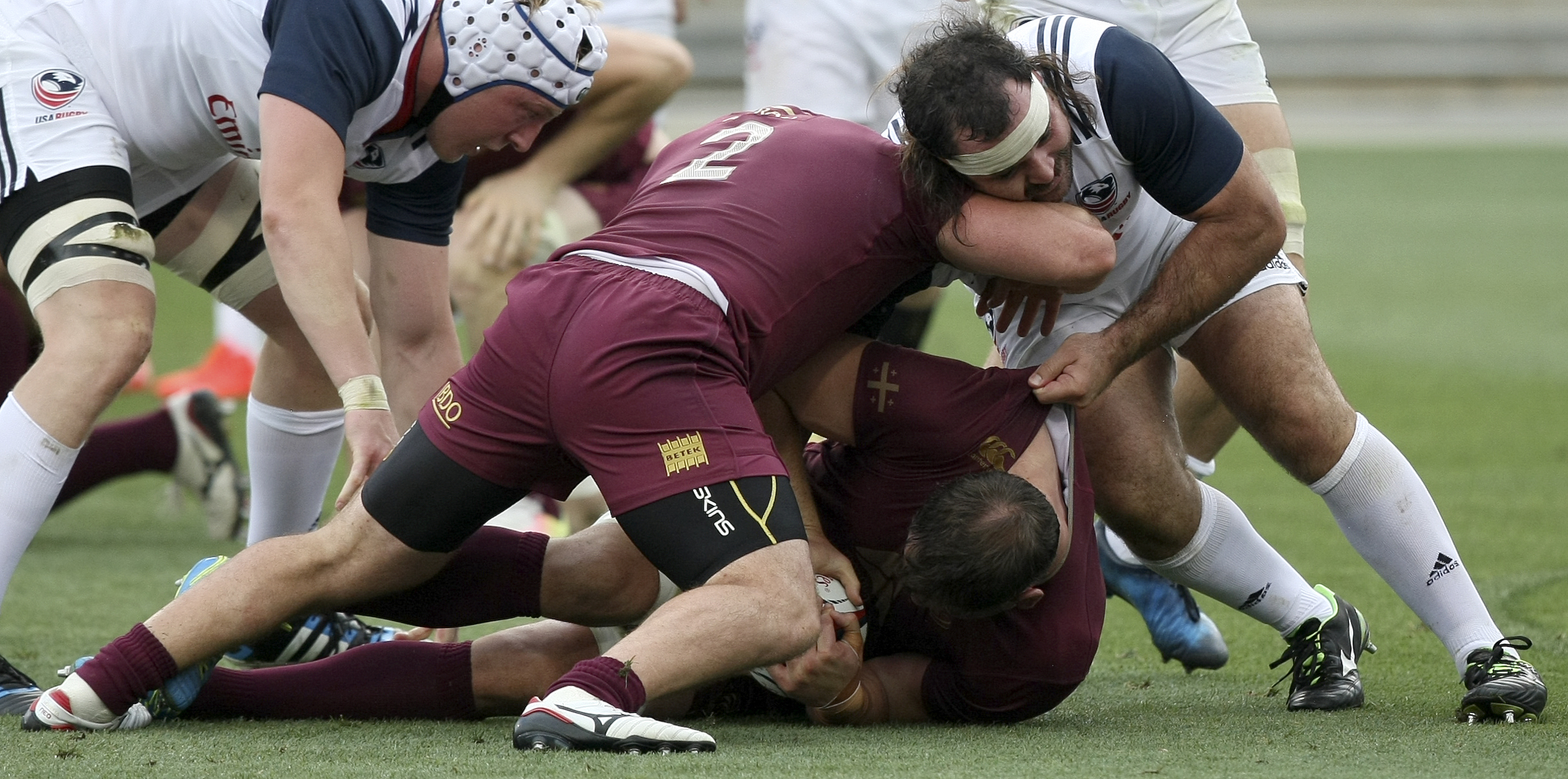 Georgia's Jaba Bregvadze (2) tries to clear USA's Chris Baumann out of a ruck during an international rugby test match at Kennesaw State University's Fifth Third Bank Stadium on Saturday, June 17, in Kennesaw, Ga.