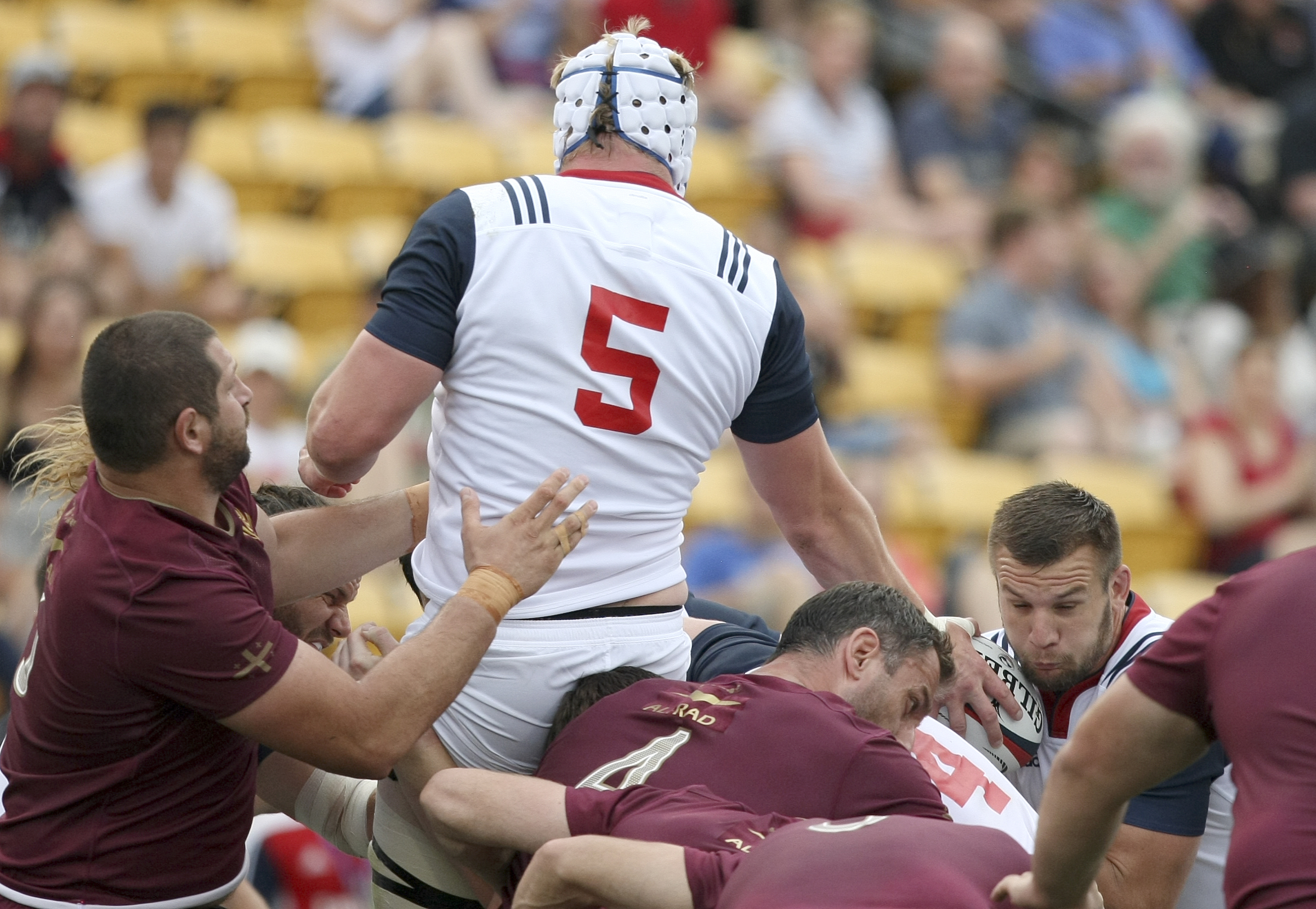 USA's Ben Landry (5) feeds the ball to Cam Dolan at the back of a maul during an international rugby test match against Georgia at Kennesaw State University's Fifth Third Bank Stadium on Saturday, June 17, in Kennesaw, Ga.