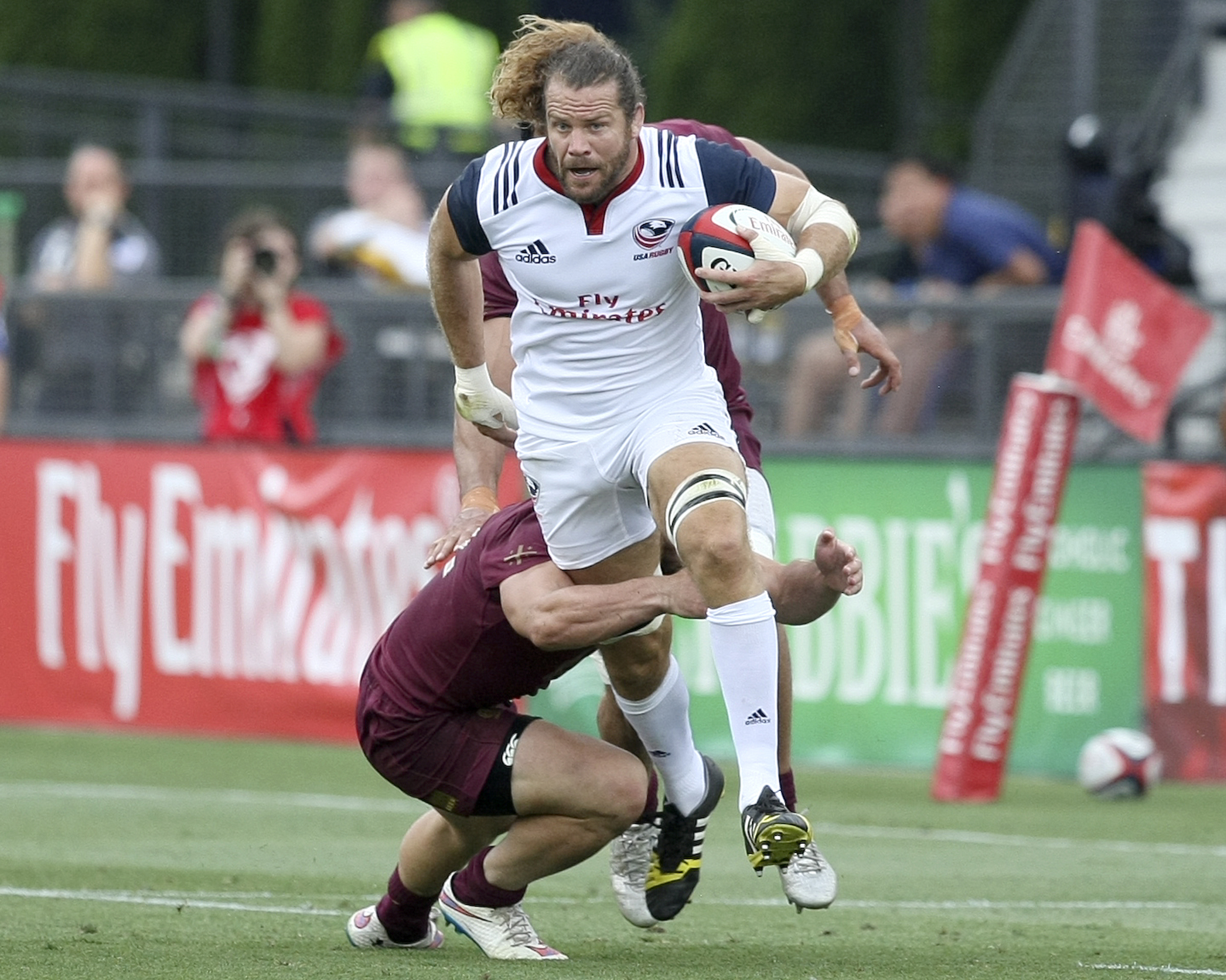 USA captain Todd Clever is tackled by Georgia captain Merab Sharikadze during an international rugby test match at Kennesaw State University's Fifth Third Bank Stadium on Saturday, June 17, in Kennesaw, Ga.