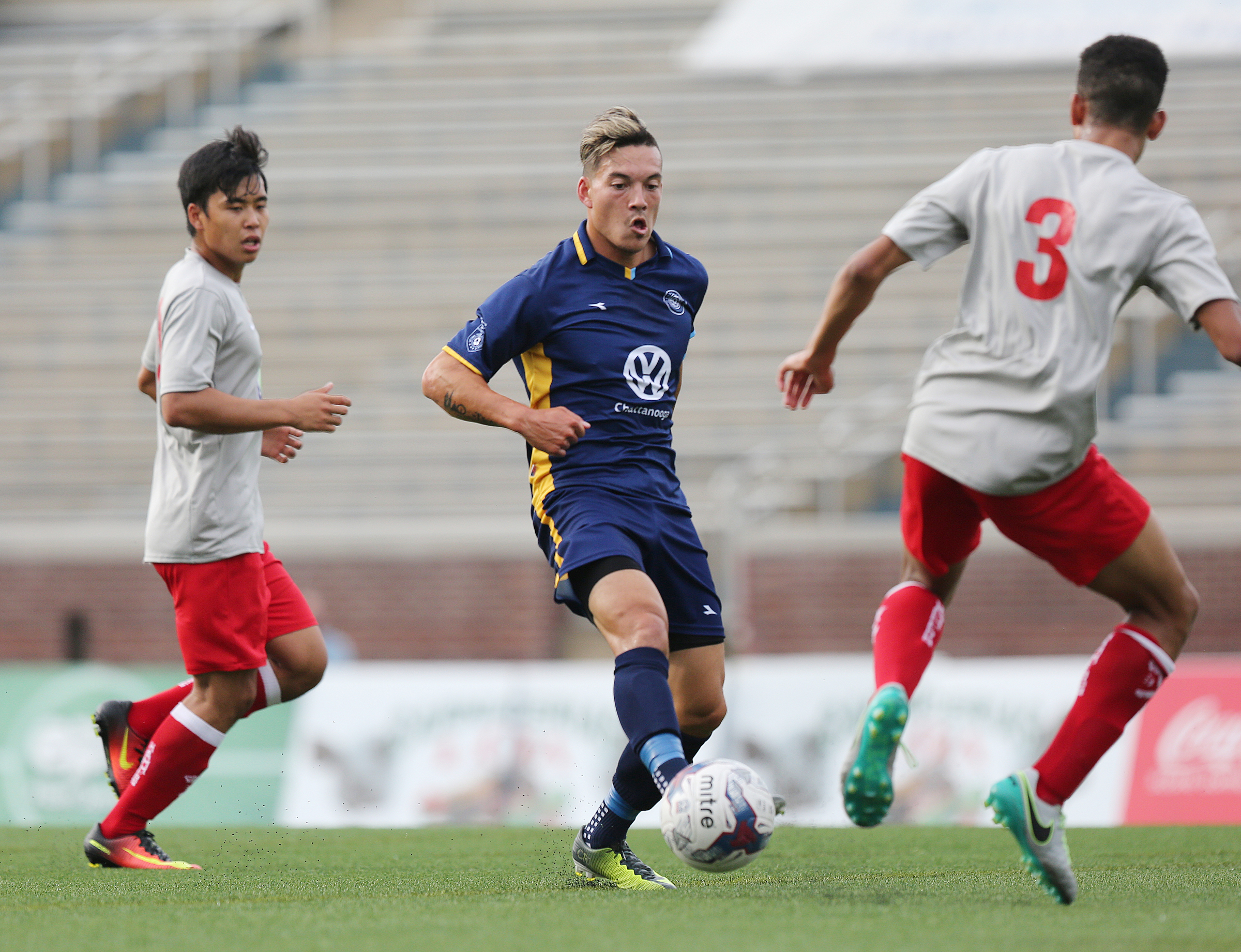 Chattanooga Football Club's John Carrier (7) passes the ball off to a teammate Tuesday, June 20, 2017, during the CFC boys game against the Birmingham Hammers at Finley Stadium in Chattanooga, Tenn. CFC won 5-0.