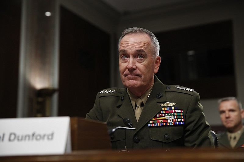 
              FILE - In this June 13, 2017 file photo, Joint Chiefs Chairman Gen. Joseph Dunford prepares to testify on Capitol Hill in Washington. Dunford said Monday, June 19, 2017, that Washington and Moscow are in delicate discussions to tamp down tensions arising from the U.S. shootdown of a Syrian fighter jet, which the Russians called a violation of a U.S.-Russian understanding on avoiding air incidents.  (AP Photo/Jacquelyn Martin, File)
            