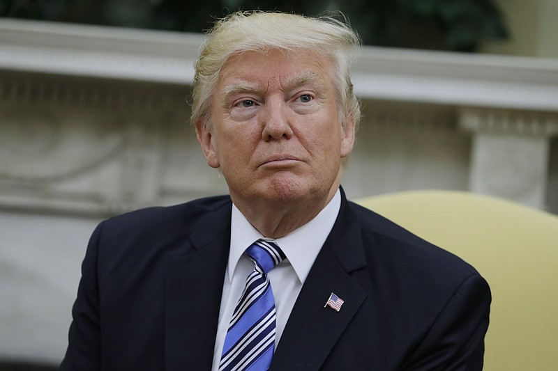 
              President Donald Trump is seen in the Oval Office of the White House in Washington, Monday, June 19, 2017. A new poll by The Associated Press-NORC Center for Public Affairs Research finds that most Americans say the federal courts were acting properly when they blocked President Donald Trump’s travel ban from going into effect. (AP Photo/Evan Vucci)
            