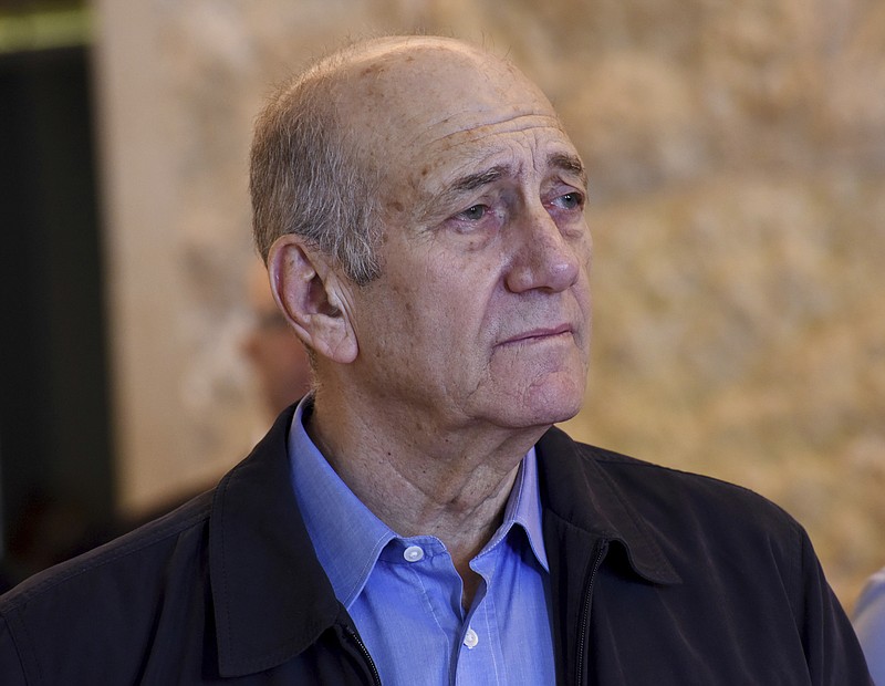
              FILE -- In this Dec. 29, 2015 file photo, former Israeli Prime Minister Ehud Olmert leaves the courtroom of the Supreme Court after the court ruled on his appeal in the Holyland corruption case in Jerusalem. A spokesman for Israel's Prison Service says imprisoned former Prime Minister Ehud Olmert was evacuated to hospital after feeling unwell. (Debbie Hill/Pool File Photo via AP)
            