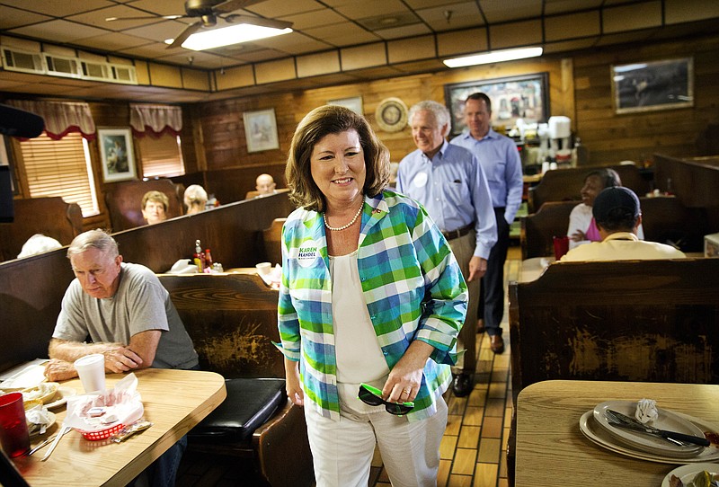 
              Karen Handel, Republican candidate for Georgia's 6th congressional district greets diners during a campaign stop at Old Hickory House in Tucker, Ga., Monday, June 19, 2017. The race between Handel and Democrat Jon Ossoff is seen as a significant political test for the new Trump Administration. The district traditionally goes Republican, but most consider the race too close to call as voters head to the polls on Tuesday. (AP Photo/David Goldman)
            