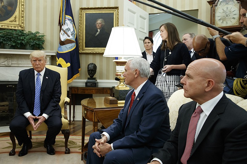 
              President Donald Trump listens during a meeting with Ukrainian President Petro Poroshenko in the Oval Office of the White House, Tuesday, June 20, 2017, in Washington. From left, Trump, Vice President Mike Pence, and National Security Adviser H.R. McMaster. (AP Photo/Evan Vucci)
            