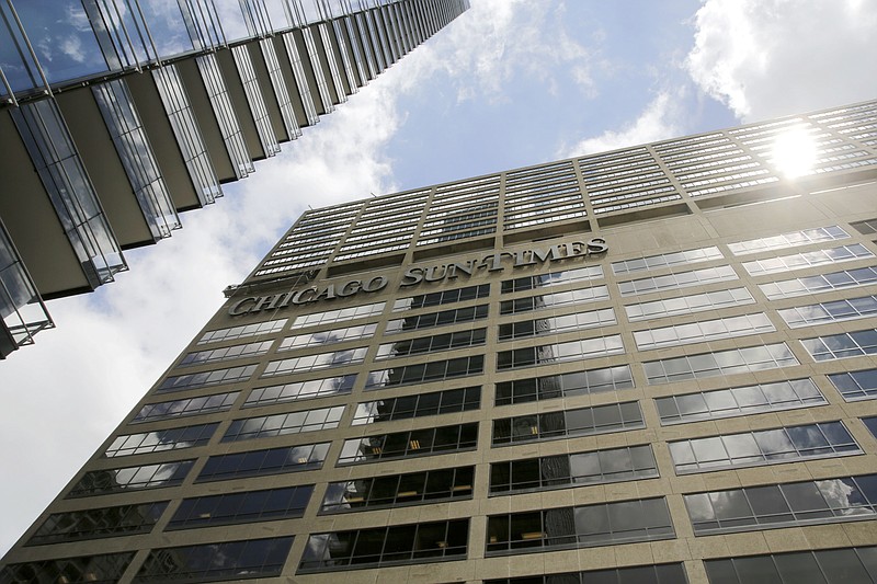 
              The building housing the Chicago Sun Times is seen Monday, June 19, 2017, in Chicago. An investor group led by former Alderman Edwin Eisendrath and the Chicago Federation of Labor, an umbrella group of labor unions, submitted a bid to purchase the Chicago Sun-Times on Monday. (AP Photo/G-Jun Yam)
            