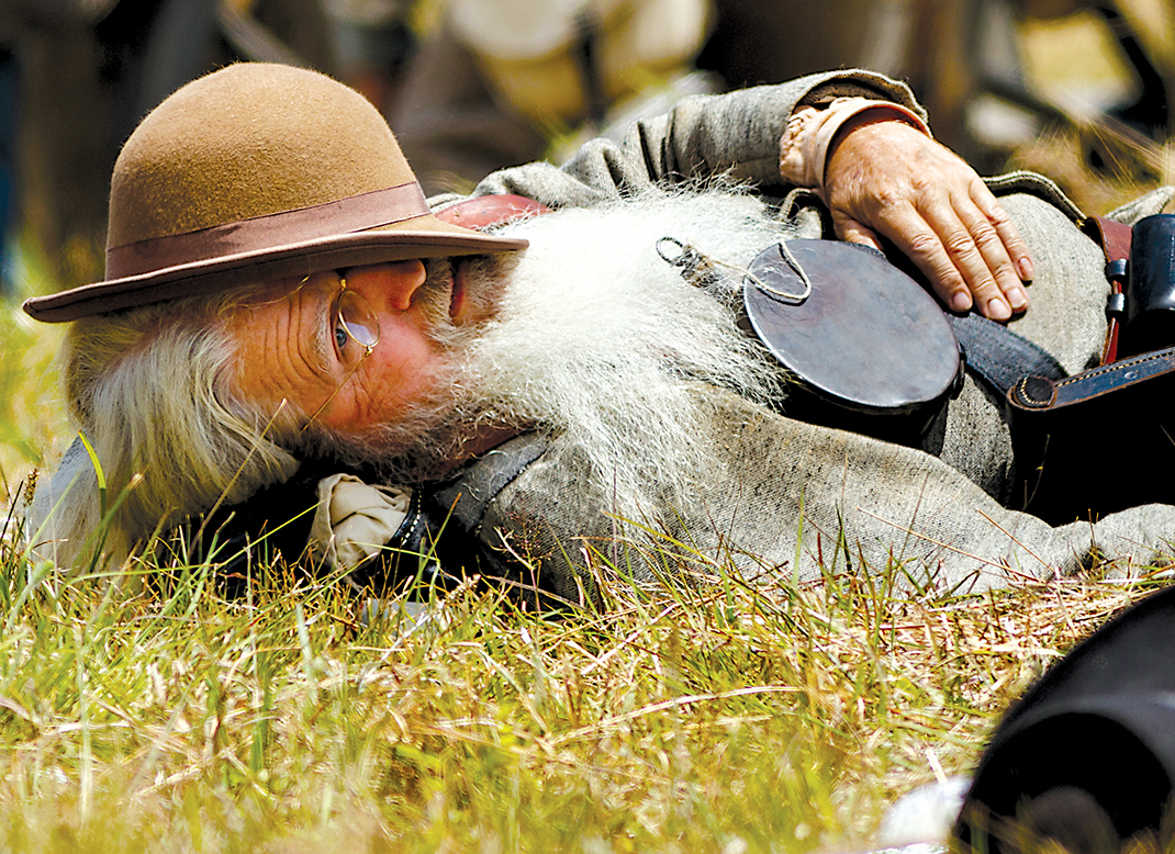 A Confederate soldier plays dead during the Battle of Resaca Reenactment, an annual event showcasing a battle fought in May 1864 as part of General Sherman's Atlanta Campaign during the Civil War.