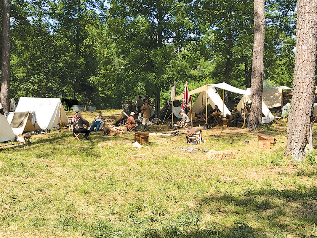 Confederate soldiers return to camp following the Battle of Resaca Reenactment.