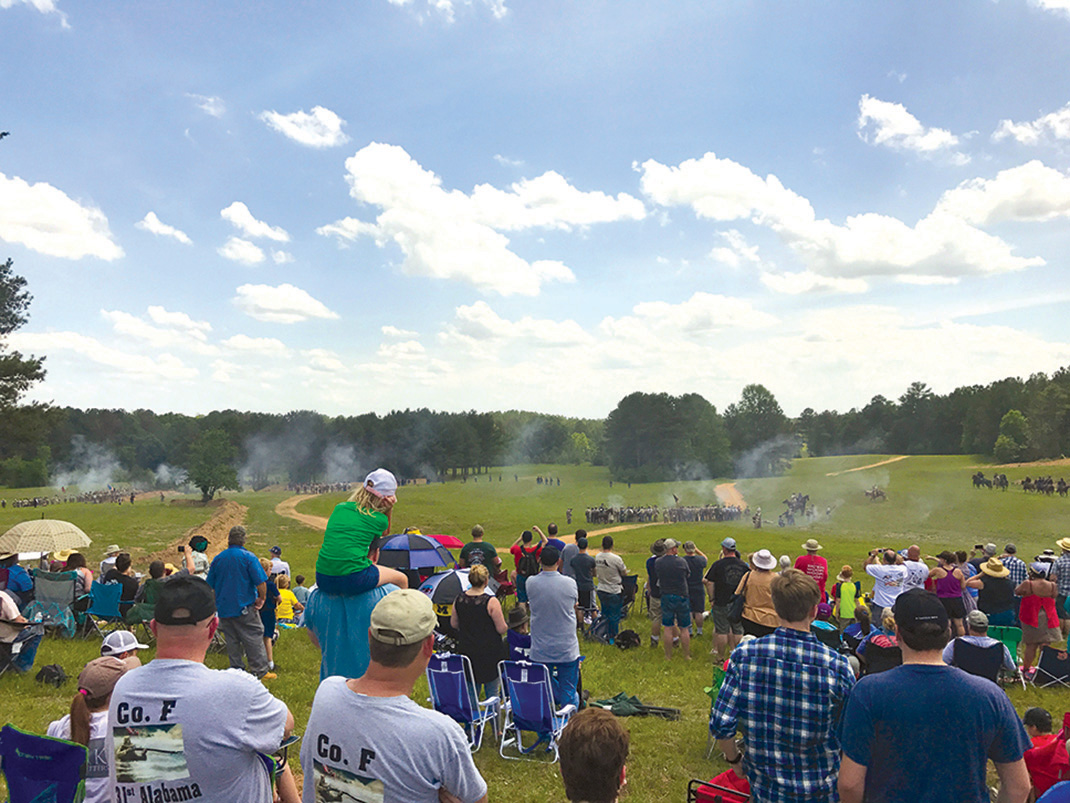 Gun powder looms in the distance during the re-enactment of the Battle of Resaca.
