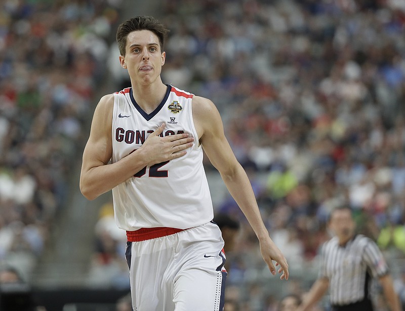 FILE - In This April 1, 2017 file photo, Gonzaga's Zach Collins reacts during the first half in the semifinals of the Final Four NCAA college basketball tournament against South Carolina in Glendale, Ariz. The role of the big man has changed in the NBA, and that’s evident in the way teams pick centers and post players entering the draft on Thursday, June 22, 2017. The Gonzaga freshman is considered a possible lottery pick entering Thursday's NBA draft. (AP Photo/Mark Humphrey, File)