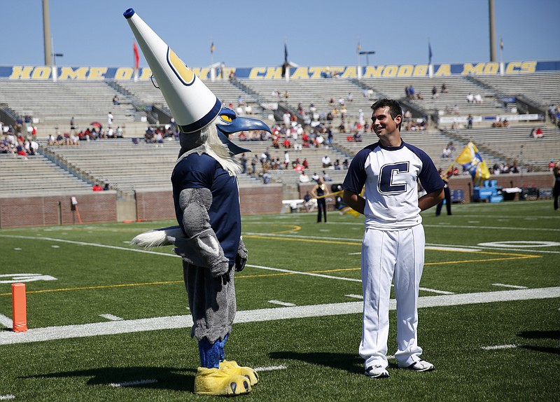 UTC mascot Scrappy wears cheerleader Peter Salvato's megaphone as a hat before the Mocs' home football game against the Samford Bulldogs at Finley Stadium on Saturday, Sept. 24, 2016, in Chattanooga, Tenn.