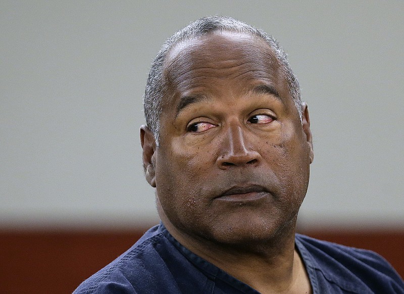 
              FILE - In this May 15, 2013, file photo, O.J. Simpson returns to the witness stand to testify after a break during an evidentiary hearing in Clark County District Court in Las Vegas. Simpson has a July 20 parole hearing that could have him released from a Nevada prison on Oct. 1, a state parole official said Tuesday, June 20, 2017. (AP Photo/Julie Jacobson, Pool, File)
            