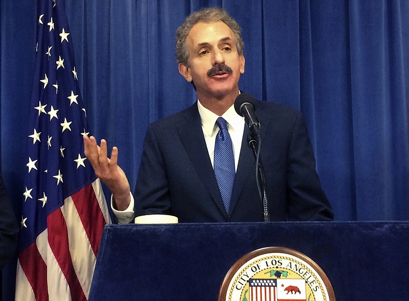 
              Los Angeles City Attorney Mike Feuer talks during a news conference on Tuesday, June 20, 2017, in Los Angeles. Authorities say a Los Angeles man accused of trafficking cocaine out of his house did so while running an unlicensed day care center. A federal criminal complaint filed this month says 48-year-old Felipe Talamante tried to sell cocaine to an undercover agent. When the men met to make the sale in May, the agent noticed that children were playing in the home's front yard. (AP Photo/Christopher Weber)
            