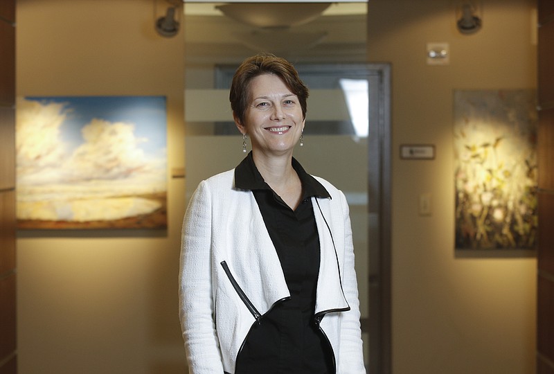 Dana Perry poses for a portrait at Chambliss, Bahner, & Stophel, P.C., on Thursday, Aug. 13, 2015, in Chattanooga, Tenn. The law firm is LEED Gold certified.