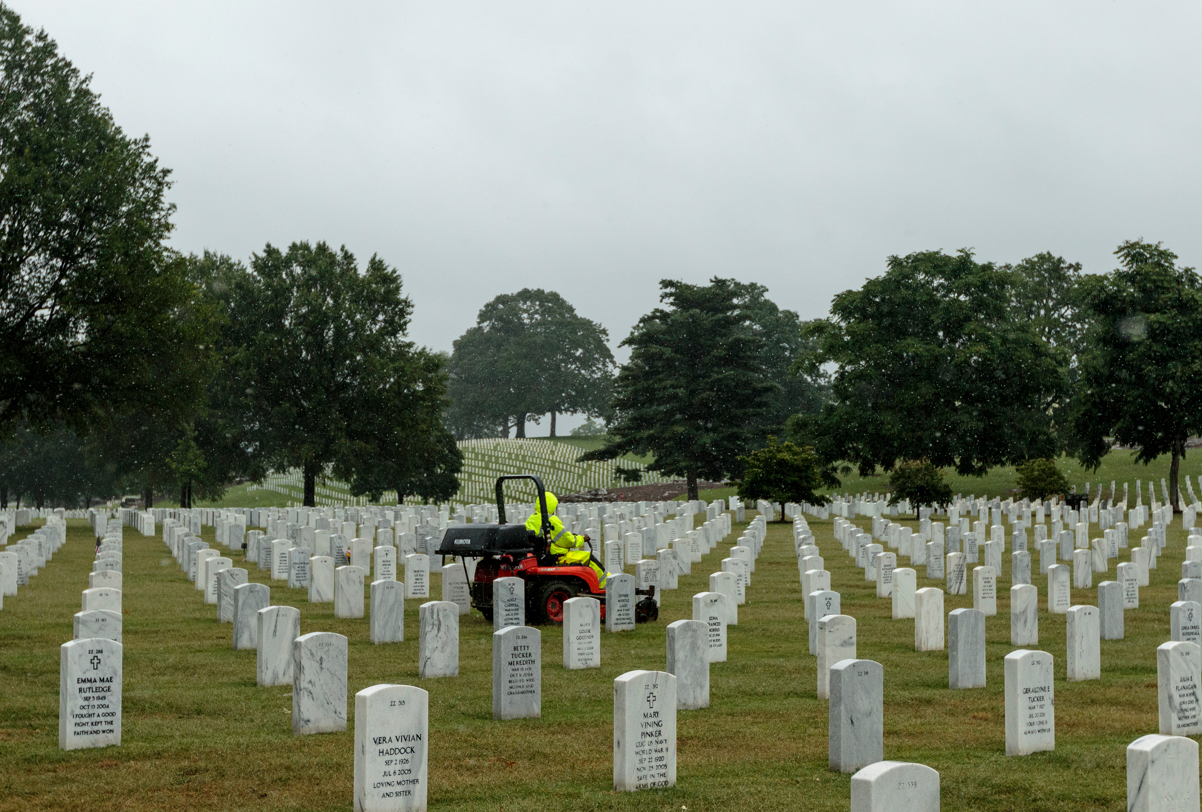 A worker mows in the Chattanooga National Cemetery after tropical storm Cindy brought rainfall to the region on Thursday, June 22, 2017, in Chattanooga, Tenn. Rain is expected to continue through Saturday.