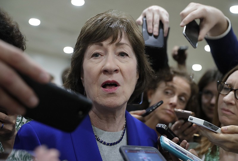 
              Sen. Susan Collins, R-Maine, speaks amid a crush of reporters after Republicans released their long-awaited bill to scuttle much of President Barack Obama's Affordable Care Act, at the Capitol in Washington, Thursday, June 22, 2017. She is one of four GOP senators to say they are opposed to it as written which could put the measure in immediate jeopardy. (AP Photo/J. Scott Applewhite)
            
