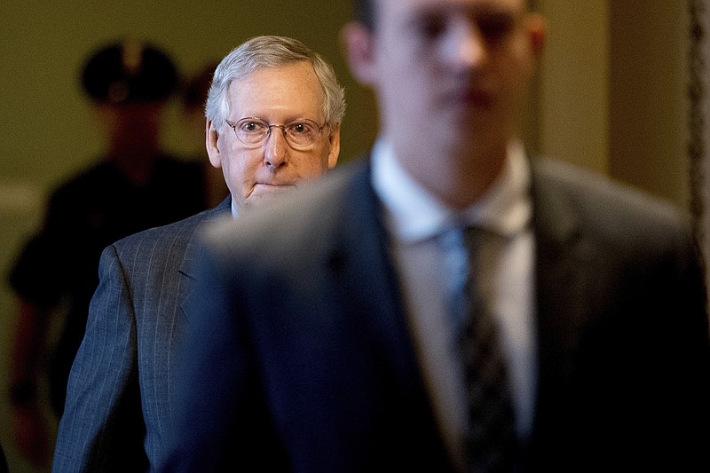 
              Senate Majority Leader Mitch McConnell of Ky. arrives on Capitol Hill in Washington, Thursday, June 22, 2017, as Senate Republicans work on a health reform bill. Senate Republicans would cut Medicaid, end penalties for people not buying insurance and erase a raft of tax increases as part of their long-awaited plan to scuttle Barack Obama's health care law. (AP Photo/Andrew Harnik)
            