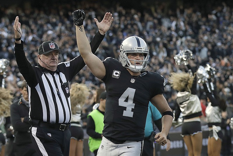 
              FILE - In this Nov. 27, 2016, file photo, Oakland Raiders quarterback Derek Carr (4) celebrates after throwing for a two-point conversion against the Carolina Panthers during the second half of an NFL football game, in Oakland, Calif. Carr tweeted Thursday, June 22, 2017, that an agreement had been reached to add five years to his current rookie deal that expires after this season. The contract will be worth $125 million, according to a person familiar with the deal who spoke on condition of anonymity because terms were not released. (AP Photo/Marcio Jose Sanchez, File)
            