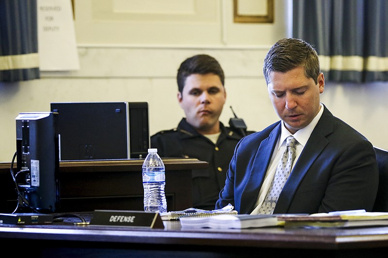 
              Ray Tensing, a former University of Cincinnati police officer, listens to Assistant Prosecutor Stacey DeGraffenreid present closing arguments at his retrial at the Hamilton County Courthouse in Cincinnati, Monday, June 19, 2017. Tensing is charged with murder and voluntary manslaughter in the shooting of unarmed black motorist Sam DuBose during a 2015 traffic stop. (Cara Owsley/The Cincinnati Enquirer via AP, Pool)
            