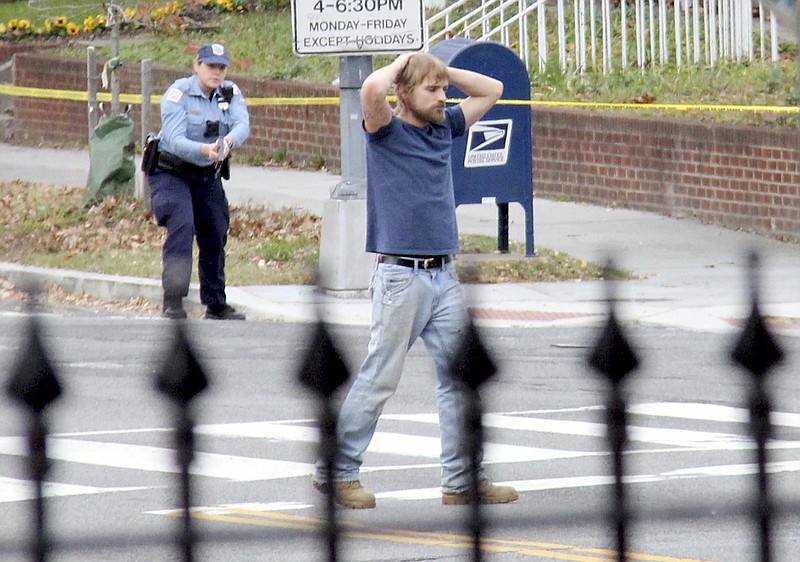 
              FILE - In this Dec. 4, 2016 file photo, Edgar Maddison Welch, of Salisbury, N.C., surrenders to police in Washington.  Welch is set to be sentenced Thursday at a hearing in federal court in Washington. (Sathi Soma via AP, File)
            