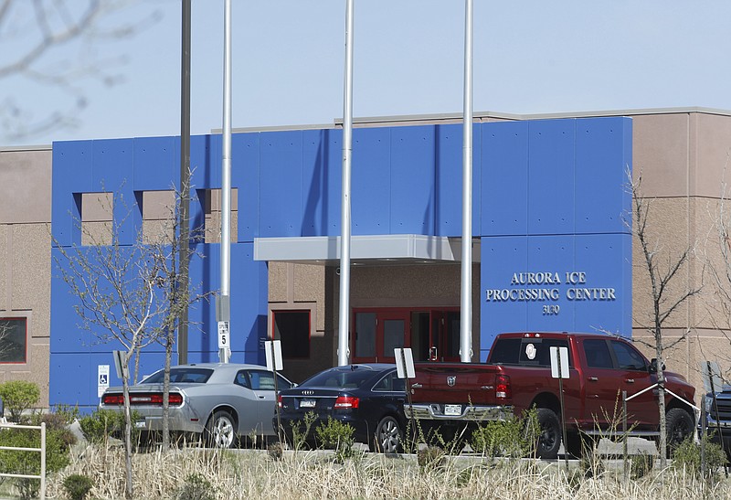 
              In this Saturday, April 15, 2017, photograph, the entrance to the GEO Group's immigrant detention facility is shown in Aurora, Colo. People once held in a privately run Colorado immigration detention center are challenging the system used to keep it clean and maintained, arguing it borders on slavery. They have won the right to sue GEO Group on behalf of an estimated 60,000 people held at its detention center near Denver over a decade. (AP Photo/David Zalubowski)
            