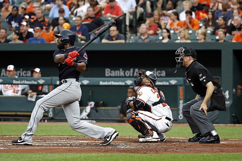 
              Cleveland Indians' Austin Jackson follows through on a triple in front of Baltimore Orioles catcher Welington Castillo and home plate umpire Adam Hamari during the second inning of a baseball game in Baltimore, Thursday, June 22, 2017. (AP Photo/Patrick Semansky)
            