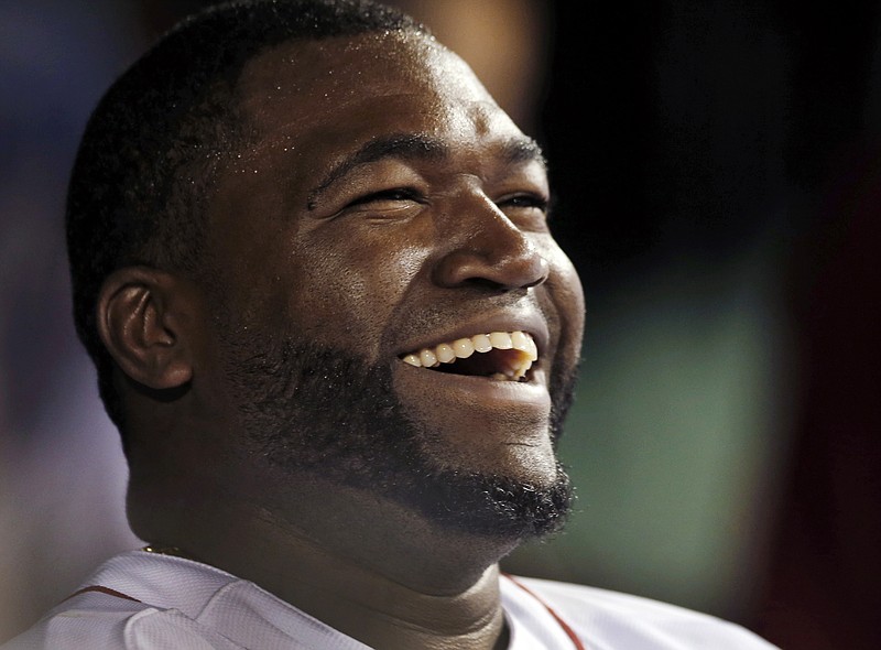 
              FILE - In this Sept. 4, 2013, file photo, Boston Red Sox designated hitter David Ortiz laughs with teammates in the dugout after hitting a double for his 2,000th career hit, in the sixth inning of a baseball game against the Detroit Tigers at Fenway Park in Boston. The Red Sox prepare to honor Ortiz, retiring the No. 34 worn by "Big Papi" when he led the once-cursed franchise to three World Series titles. The ceremony is Friday night, June 23, 2017.  (AP Photo/Elise Amendola, File)
            
