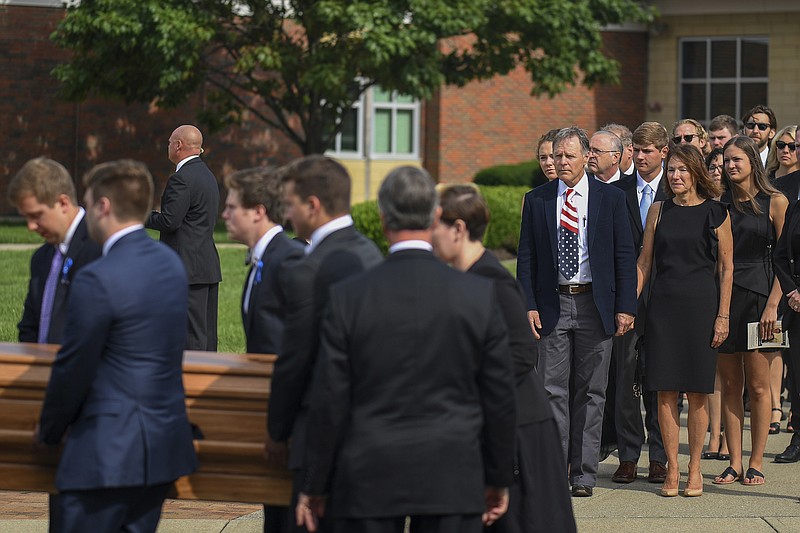 
              Fred and Cindy Warmbier watch as their son Otto, is placed in a hearse after his funeral, Thursday, June 22, 2017, in Wyoming, Ohio. Otto Warmbier, a 22-year-old University of Virginia student who was sentenced in March 2016 to 15 years in prison with hard labor in North Korea, died this week, days after returning to the United States. (AP Photo/Bryan Woolston)
            