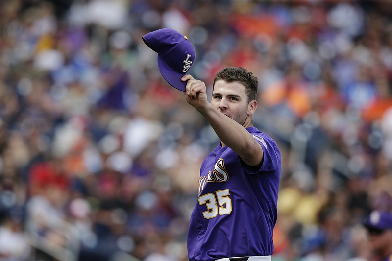 
              LSU pitcher Alex Lange (35) gestures as he leaves the game during the eighth inning of an NCAA College World Series baseball game against Oregon in Omaha, Neb., Friday, June 23, 2017. (AP Photo/Nati Harnik)
            