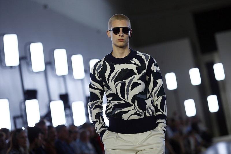 
              A model wears a creation as part of Cerruti Men's Spring Summer 2018 fashion collection, presented in Paris, France, Friday, June 23, 2017. (AP Photo/Francois Mori)
            